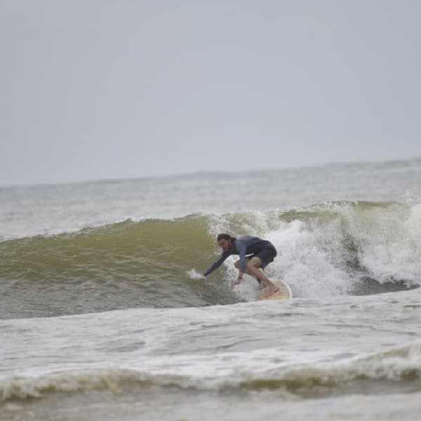 Kirill surfing a wave in Sri Lanka